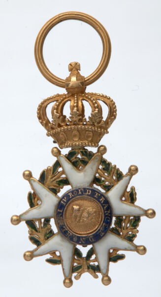 5. A miniature of the Officer's Cross of the Legion of Honor